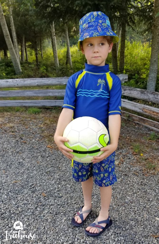 kid wearing swimming clothes for camping