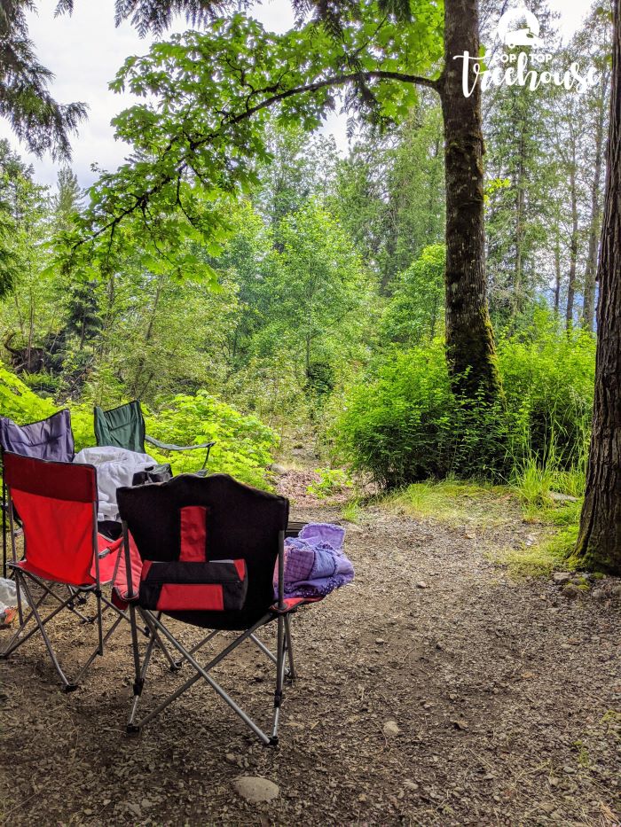 camp chairs around fire