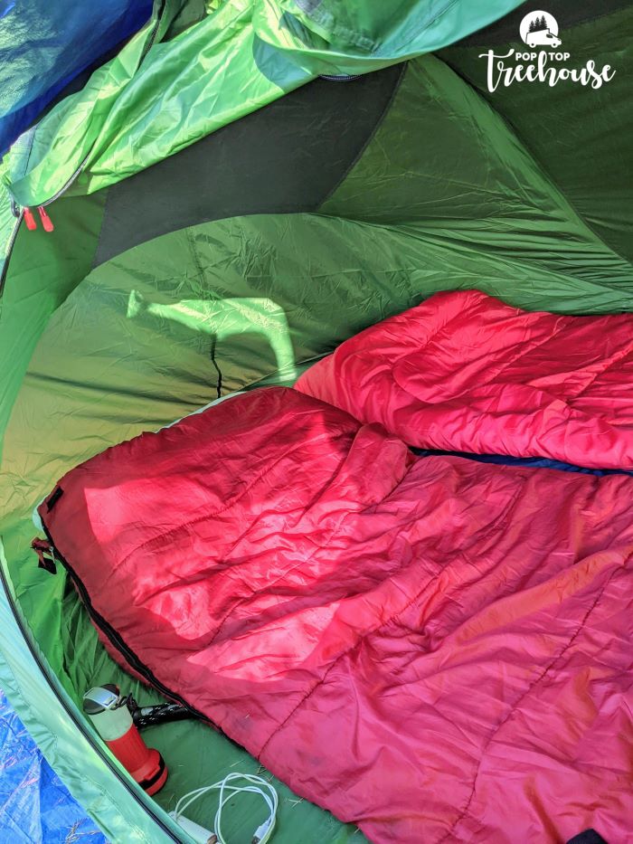 red sleeping bags in tent