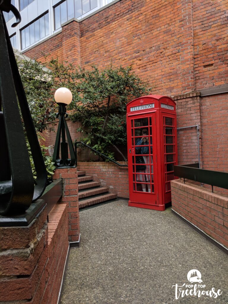 phone booth in front of brick building