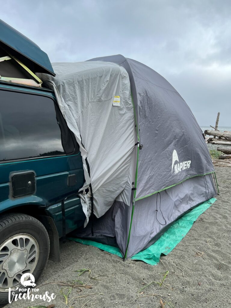 camper with SUV tent attached to back